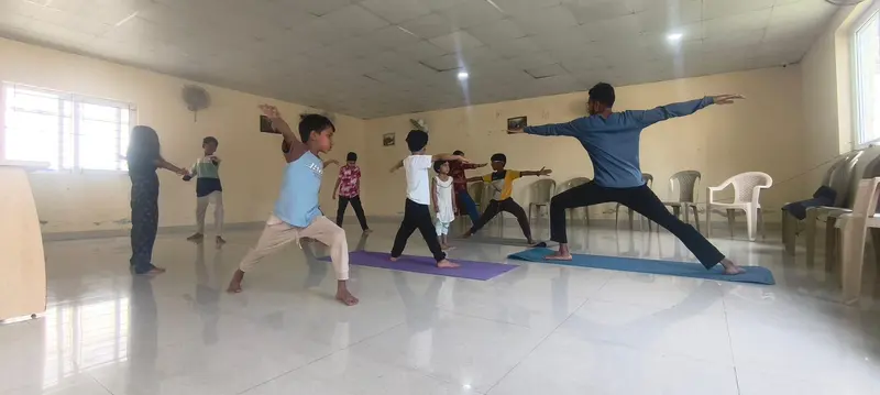 Yoga class in warrior pose